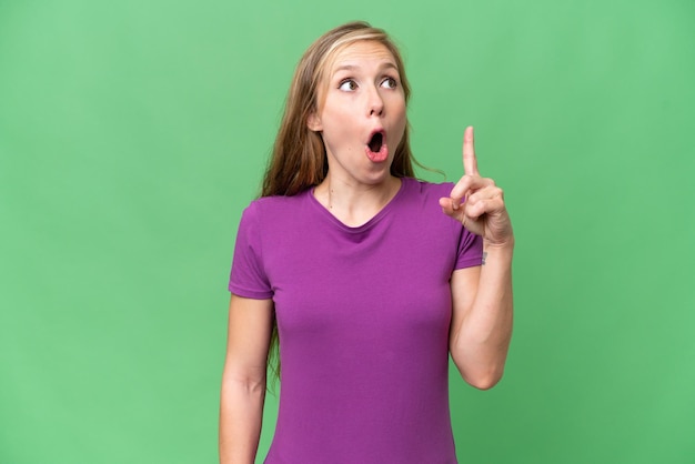 Young blonde woman over isolated background thinking an idea pointing the finger up