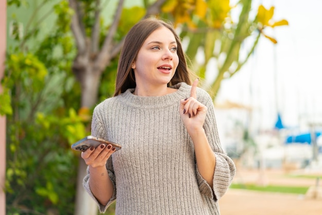 Young blonde woman over isolated background