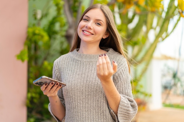 Young blonde woman over isolated background