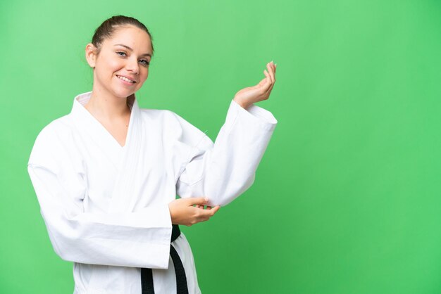 Young blonde woman over isolated background