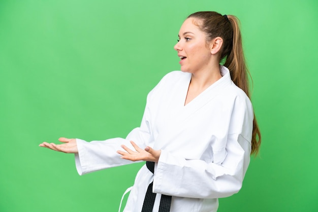 Young blonde woman over isolated background