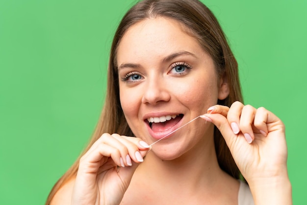 Young blonde woman over isolated background