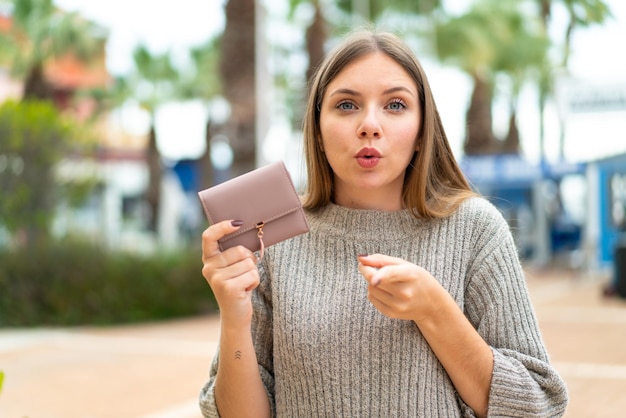 Young blonde woman over isolated background