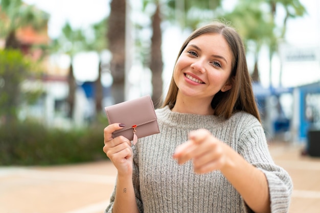 Young blonde woman over isolated background