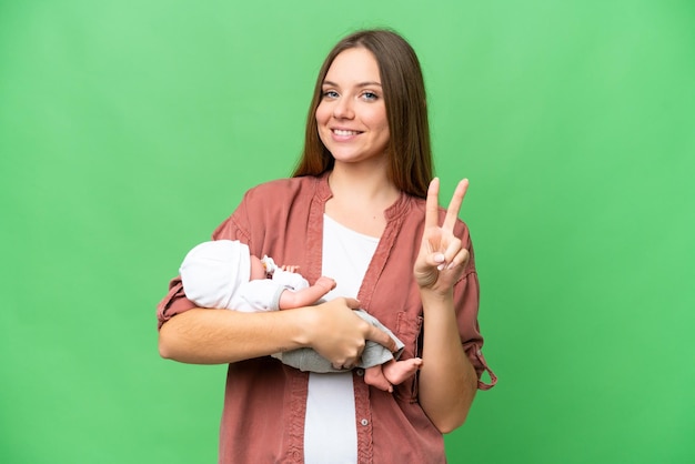 Young blonde woman over isolated background