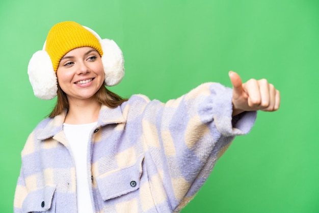 Young blonde woman over isolated background