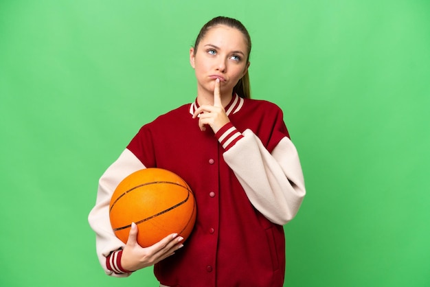 Young blonde woman over isolated background