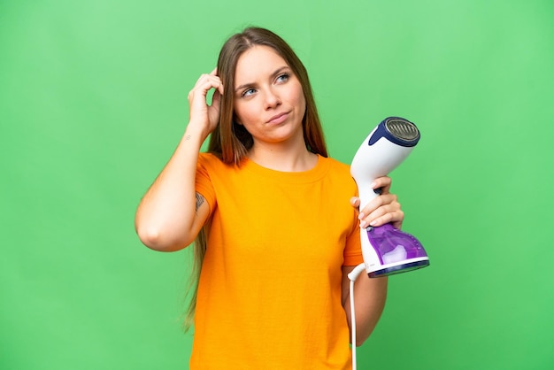 Young blonde woman over isolated background