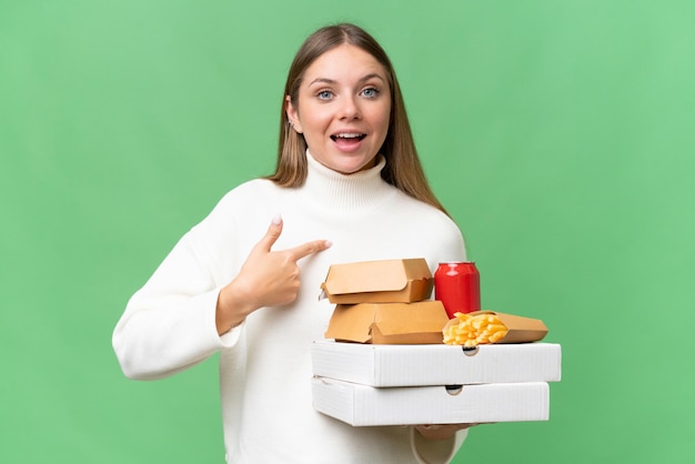 Young blonde woman over isolated background