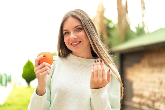 Young blonde woman over isolated background