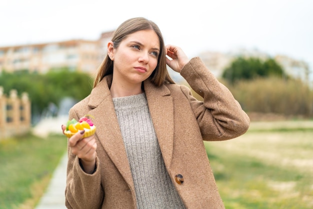 Young blonde woman over isolated background