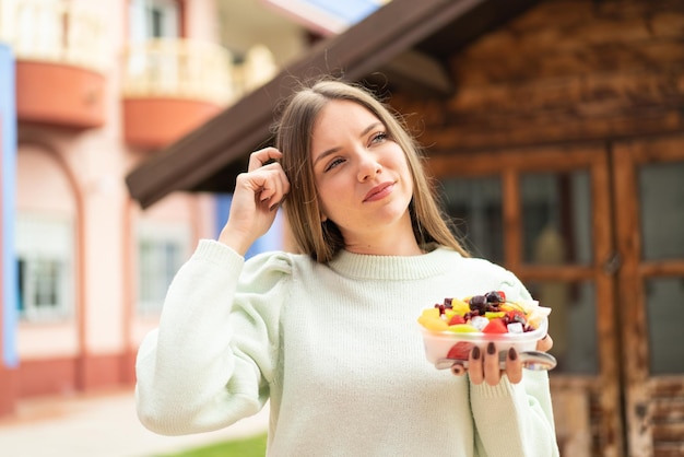 Young blonde woman over isolated background