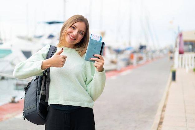 Young blonde woman over isolated background