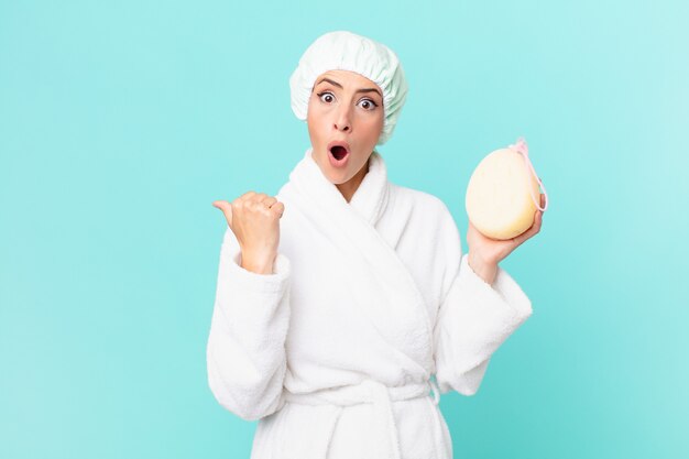 Young blonde woman looking astonished in disbelief. shower concept.