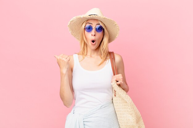 Young blonde woman looking astonished in disbelief