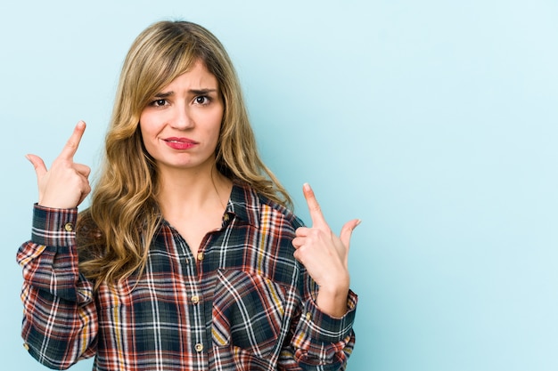 Young blonde woman looking disappointment