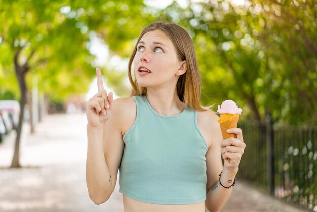 Young blonde woman at outdoors