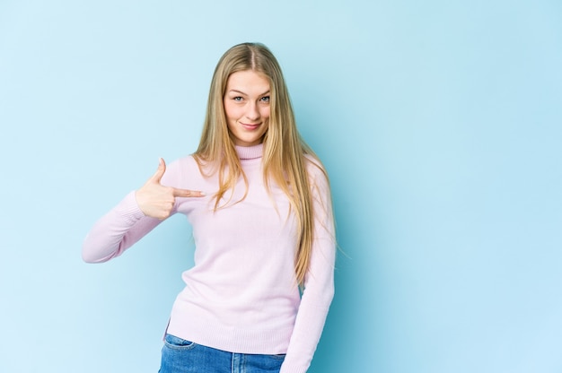 Young blonde woman person pointing by hand