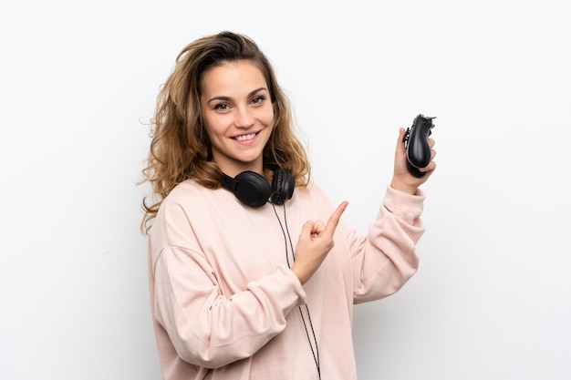 Young blonde woman playing at videogames