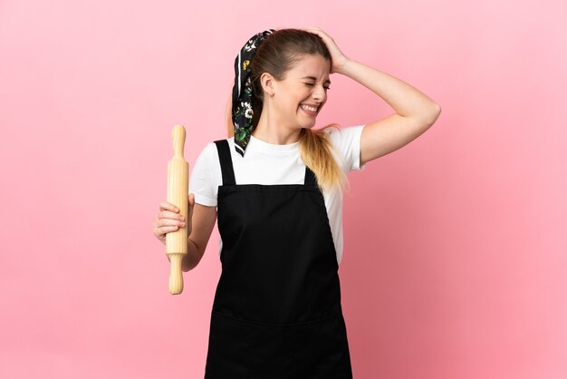 Young blonde woman posing isolated against the blank wall