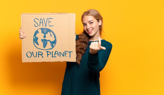 Young blonde woman. save the planet concept