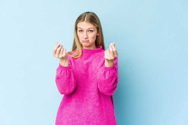 Young blonde woman showing that she has no money.