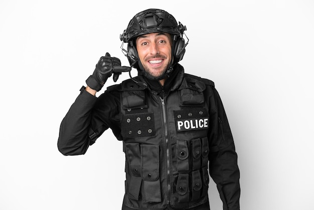 Young blonde woman with a motorcycle helmet and a key doing surprise gesture over isolated background