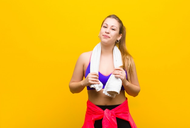 Young blonde woman with a towel. sport concept