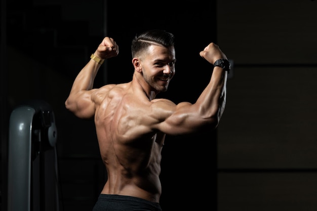 Young Bodybuilder Flexing Back Pose