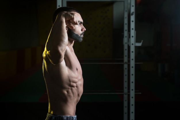 Young Bodybuilder Flexing Muscles Double Biceps Pose