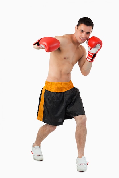 Young boxer performing a right hook