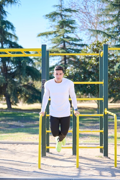 young boy exercising in a park
