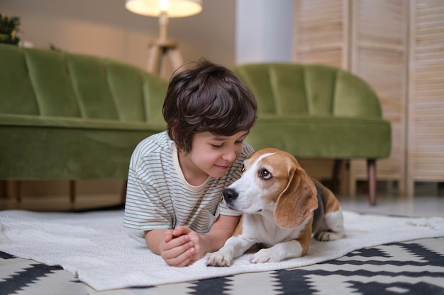 Young boy and faithful pet enjoying playful time together in a funfilled living room heartwarming