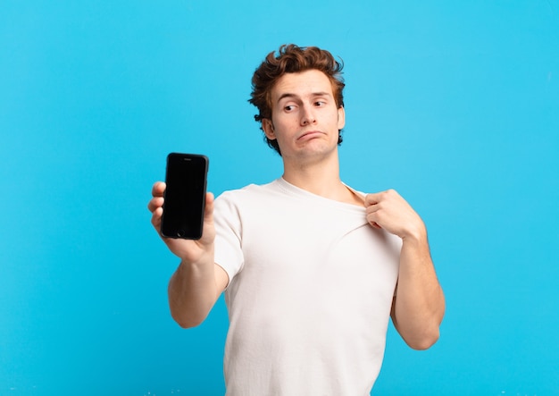 Young boy feeling stressed, anxious, tired and frustrated, pulling shirt neck, looking frustrated with problem. telephone screen concept