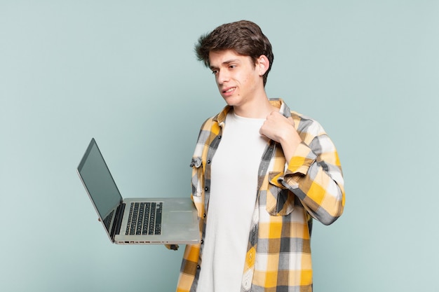 Young boy feeling stressed, anxious, tired and frustrated, pulling shirt neck, looking frustrated with problem