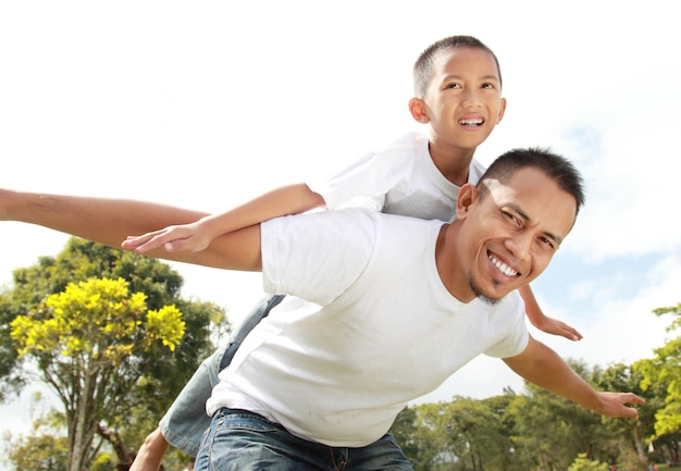 Young boy having piggyback ride