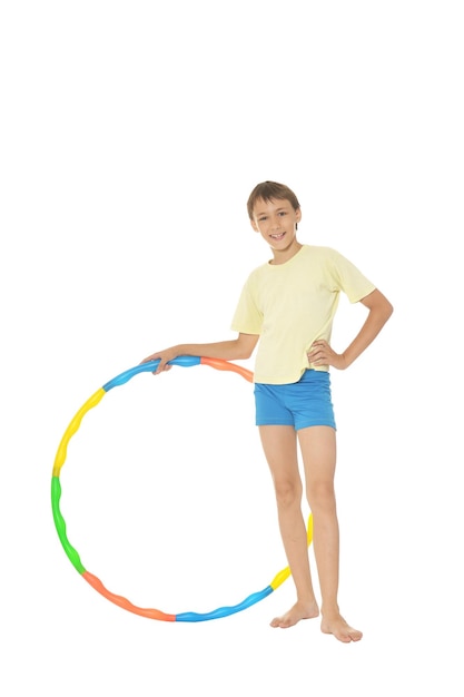 Young boy holding hoop isolated on white background