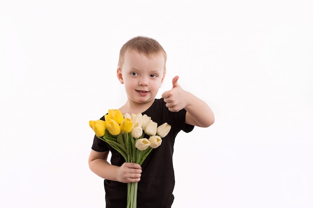 Young boy holding tulips