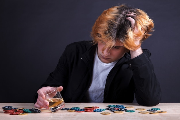 Young boy holding whiskey