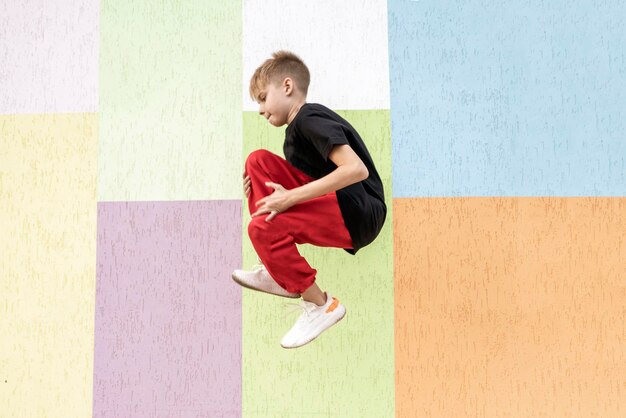 A young boy jumping in the air, success concept, feel happy and free