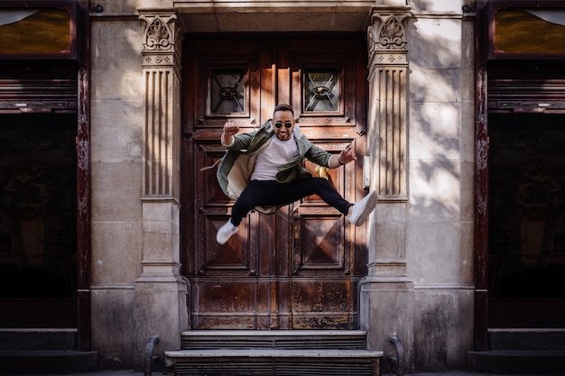 Young boy jumping on the street