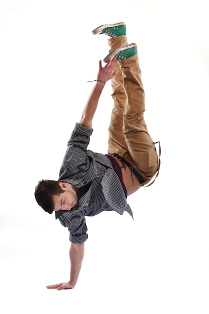 young boy man teen dancing and jumping isolated on white background in studio