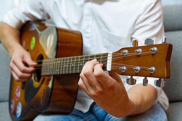 Young boy playing guitar.