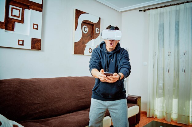 Photo young boy playing video games with 3d glasses