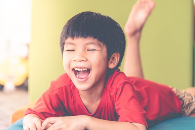 Young boy screaming out un happy with his toy