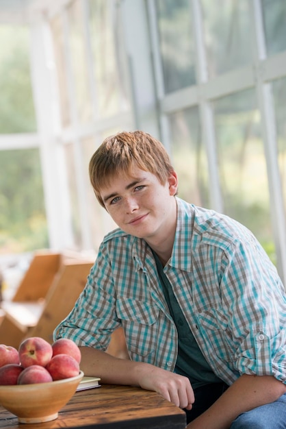 A young boy seated at a table