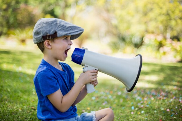 Young boy speaking on megaphone