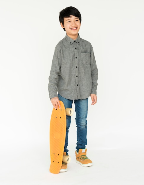 Young boy standing and posing for photoshoot