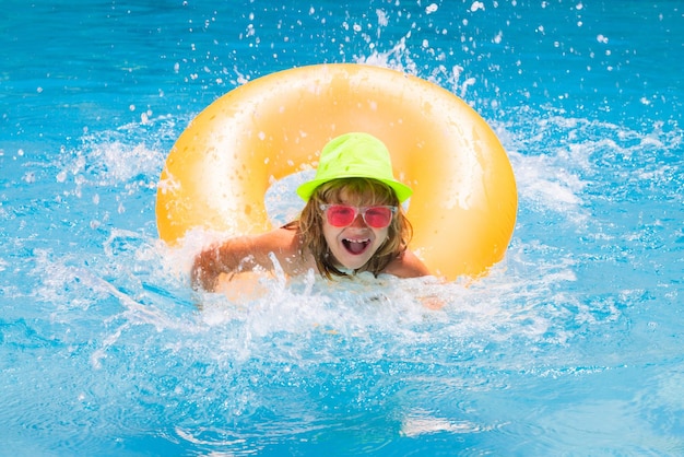 Young boy swim in pool child boy rest in swimming pool