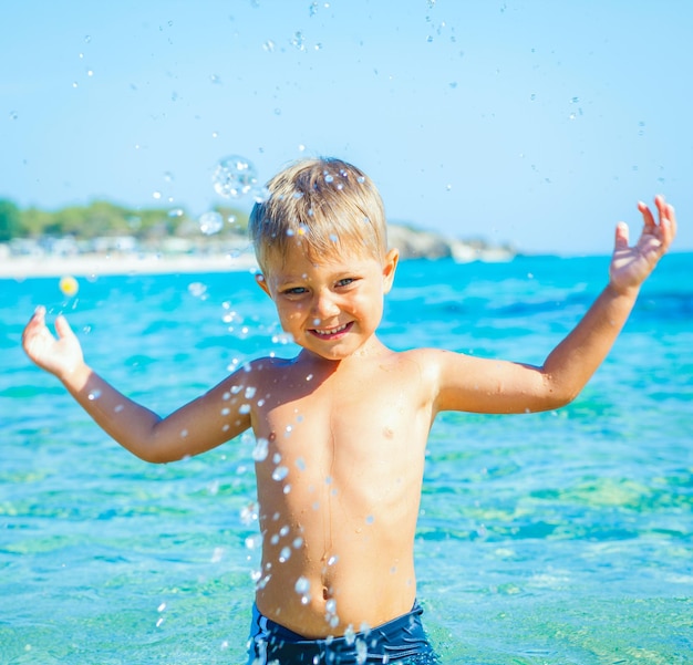 Young boy swimming in sea